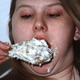 Selma, AL, eater Barb Hodges swallows a chicken drumstick with the aid of Hellmann's QX-1.